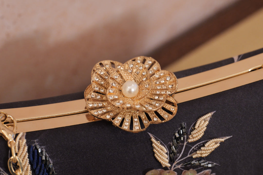 The Lyra Iconic Clutch